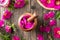 Fresh rosa rugosa flowers in a wooden mortar