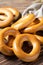 Fresh round bagels of wheat flour on a wooden table