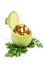 Fresh round light green zucchini filled with peas, chopped tomato and zucchini on parsley isolated on white