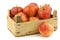 Fresh royal gala apples in a wooden crate