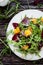 Fresh salad with arugula, orange and beetroot