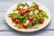 Fresh salad with arugula, radicchio, tomato cherry, baby mozzarella, walnuts