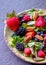 fresh salad ,with blue berries, raspberries, black berries, and strawberries