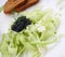 Fresh salad of cucumbers with caviar