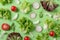 Fresh salad ingredients arugula, lettuce, radish, and tomato on green background