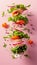 Fresh salad ingredients arugula, lettuce, radish, and tomato on pink background