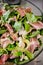 Fresh salad with lamb lettuce, avocado and prosciutto