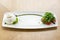 Fresh Salad with tomatoes, basil, burrata, and olive oil on wooden background. Italian traditional caprese salad