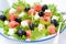 Fresh salad with watermelon, feta cheese and olives, close-up