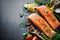 Fresh salmon fillet with aromatic herbs, spices and vegetables