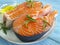 Fresh salmon gourmet in a plate  wooden background