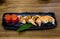 Fresh salmon sushi , salmon maki roll Japanese food restaurant, salmon sushi on plate. Sushi platter with a mixed variety of the