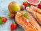 Fresh salmon, tomato tasty appetizer on concrete background seafood dinner