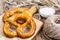 Fresh salty German bread: pretzels on a background of old boards