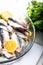 Fresh sardines. Fish with vegetables. Sardines prepared to be cooked on a baking tray