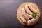 Fresh sausages on a chopping board, top view