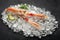 Fresh scampi shrimp on ice on a stone table