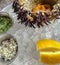 Fresh sea urchin on a plate with ice, lemon and sauce