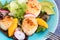 Fresh seared sea scallops salad with mango, radish, avocado on b