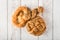 Fresh seedy breads on white wooden background