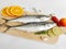 Fresh Seer Fish,King Fish decorated with herbs and vegetables on a wooden pad,Selective Focus