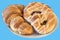 Fresh Sesame Croissant Puff Pastry And Pretzel Served On White Plate Isolated On Blue Background