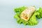 Fresh shawarma in lavash with chicken and vegetables on a lettuce leaf