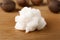 Fresh shea butter on wooden table, closeup