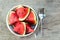 fresh slice of watermelon in cup on woods