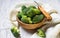 Fresh sliced broccoli in wooden bowl