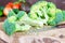 Fresh sliced broccoli on the wooden cutting board closeup. Healthy dieting eating concept