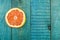 Fresh sliced grapefruit on a blue wooden background