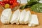 Fresh sliced halloumi cheese from Cyprus on a wooden board