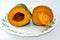 Fresh sliced mangoes fruits served on a plate  on white background, fresh mango fruit