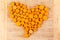 Fresh sliced orange carrots arranged in a heart