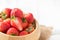 Fresh sliced Red berry strawberries in wood bowl