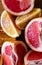 Fresh sliced Sicilian Blood orange fruits and grapefruit on wood background