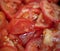 Fresh sliced tomato pieces background. selective foucs