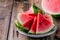 Fresh sliced watermelon on wooden rustic background