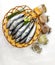 Fresh Small Tuna Fish Decorated with herbs on a bowl White Background.Selective focus