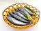 Fresh Small Tuna Fish Decorated with herbs on a bowl White Background.Selective focus