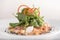 Fresh smoked salmon salad,  served with rucola and baby spinach and pieces of vegetables,  decorated with herbs,  placed on white