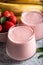 Fresh smoothie with banana and strawberry in the glasses. Healthy breakfast or snack