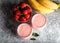 Fresh smoothie with banana and strawberry in the glasses. Healthy breakfast or snack. Top view