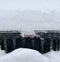 Fresh snow on black Jeep