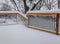 Fresh snow coating railing on a deck and stair case