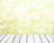 Fresh soft green spring background with white bokeh and white wooden planks