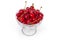 Fresh sour cherries in the glass cup on white background