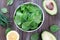 Fresh spring baby leaves of spinach with water drops in bowl