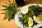 Fresh spring green dandelion salad with eggs on a plate closeup